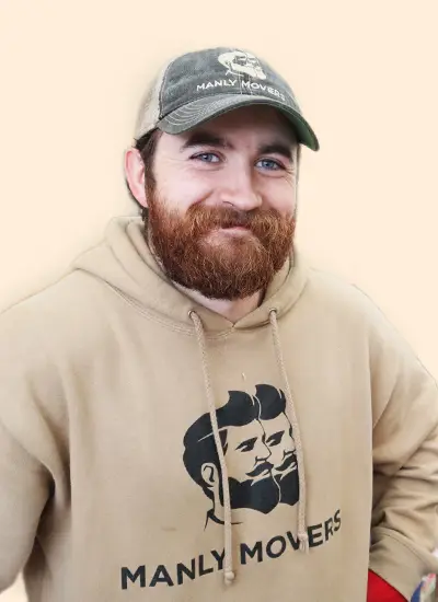 A man wearing a hoodie with the words manly movers on it.