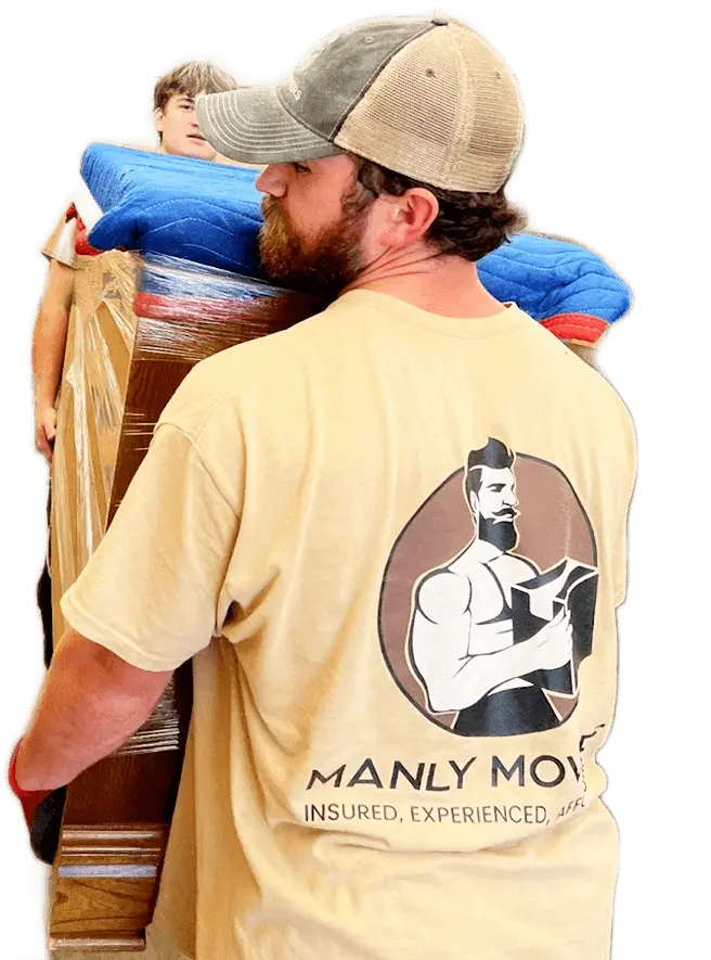 A man carrying a t - shirt with the words manly mover on it.